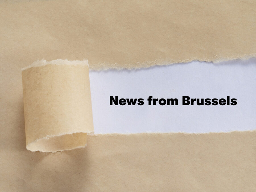 closeup shot of a torn envelope with "News from Brussels!