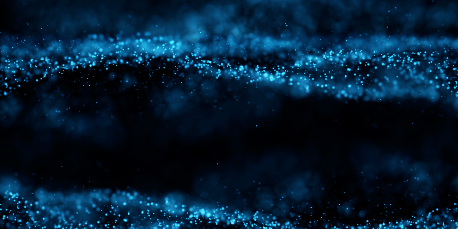 Decorative image showing abstract particles in bluish colors rendering on dark background.