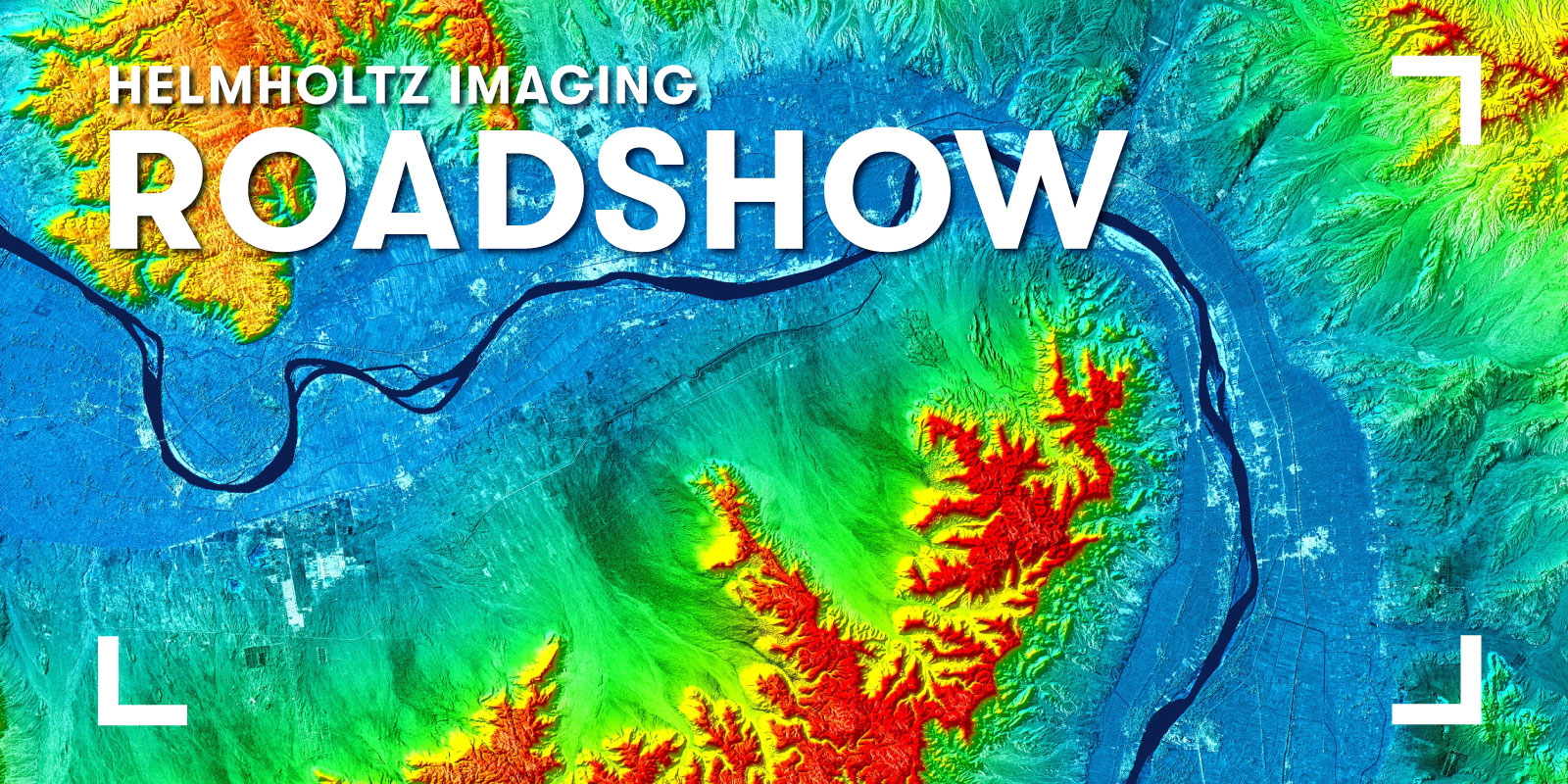 Promotional banner for the Helmholtz Imaging Roadshow featuring a color-coded elevation map with mountains, valleys, and a river. Large white text reading “Helmholtz Imaging Roadshow” is displayed over the map, with white corner markers framing the composition.