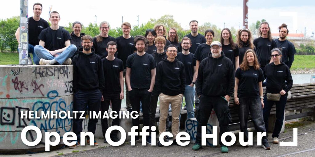 Group of Helmholtz Imaging team members standing outdoors, wearing matching black T-shirts and hoodies with the Helmholtz Imaging logo. Text on the image reads: “Helmholtz Imaging Open Office Hour.”